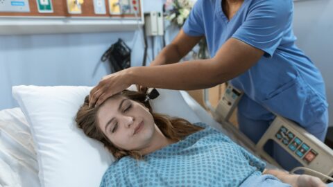 crop black doctor checking up of patient